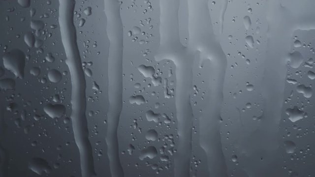 Raindrops on window as abstract background