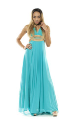 Full body portrait of a beautiful young african woman in a turquoise dress