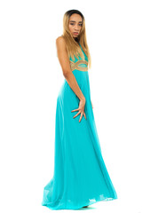 Full body portrait of a beautiful young african woman in a turquoise dress