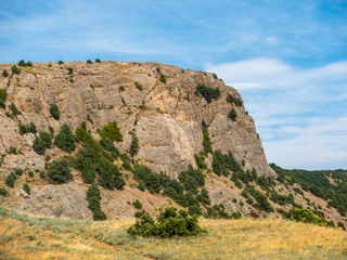 Fototapeta na wymiar the mountainous landscape. view of the high steep cliff. picturesque sky with clouds. Crimea