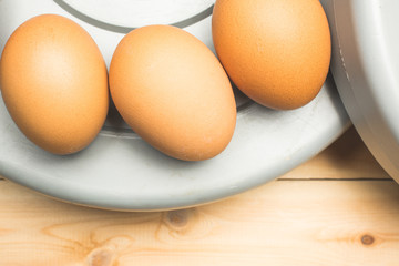 Yellow chicken eggs lie on pancakes from a sports barbell