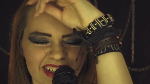 Singing rock girl with microphone