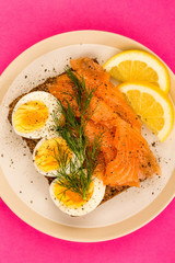 Smoked Salmon With boiled Eggs Open Face Sandwich On Rye Bread With Dill