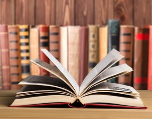 Open book on wooden table