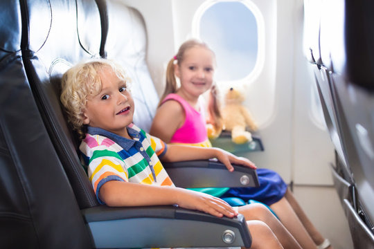 Kids flying airplane. Fligh with children.