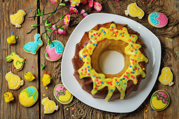 Easter Bundt cake with colorful topping and Easter Cookies
