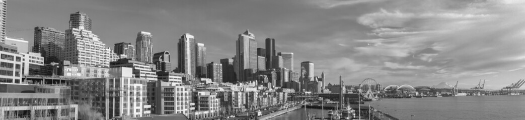 Panorama banner format downtown Seattle waterfront in black and white.