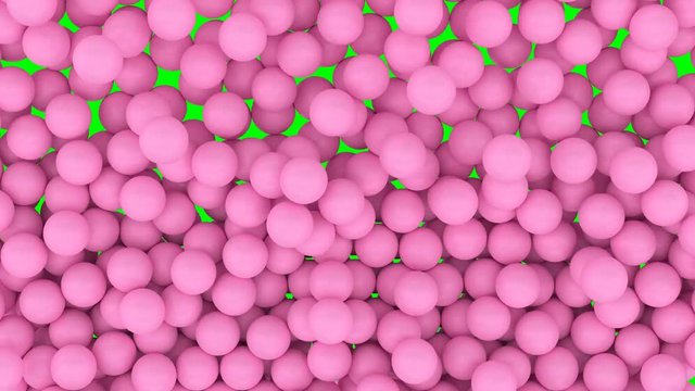 Animated falling and bouncing a lot of pink or magenta plain Ping-pong balls filling container against green background. Front camera shot.