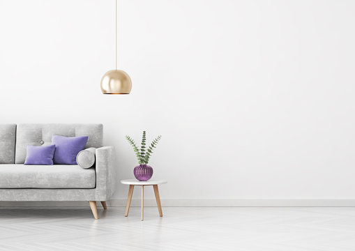 Livingroom interior wall mock up with grey velvet sofa, violet pillows, hanging lamp, vase and coffee table on empty white background. 3D rendering.