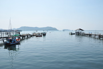 image of landscape blue sky cloudy with boat and jetty and sea.That place for vacation in Chonburi province , eastern Thailand. concept nature background vacation holiday tourism.