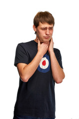 A young handsome guy has a sore throat. A man in everyday clothes is ill with a cold, sore throat,...