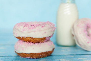 Tasty donuts with pink sprinkles