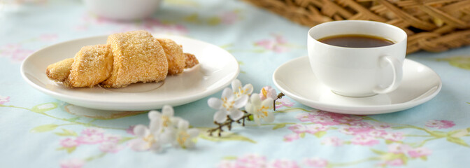 Many croissants on a table with spring flowers