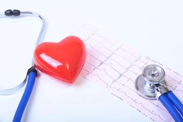 Heart with a medical stethoscope, isolated on wooden background