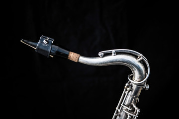 Close up of a silver saxophone