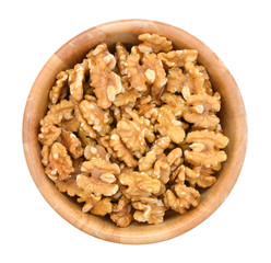 Walnut in wooden bowl on white