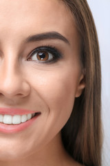 Beautiful young woman with eyelash extensions, closeup