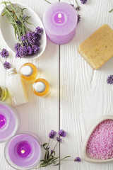 Obraz na płótnie Canvas lavender SPA products, flat lay. soap, essential oils, bath salt and aromatherapy candles