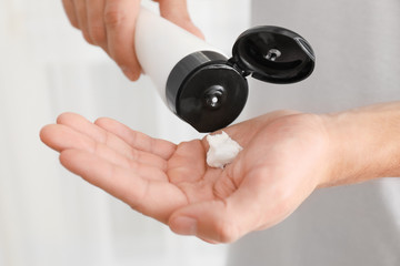 Man applying hand cream, closeup