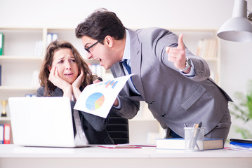 Angry boss unhappy with female employee performance