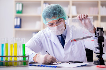 Forensics investigator working in lab on crime evidence