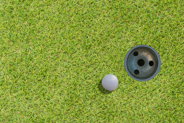golf ball on green top view.with space for text.