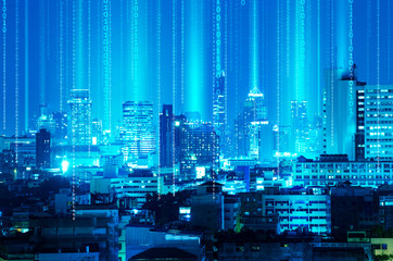 abstract light beam and digital signal over night blue city background