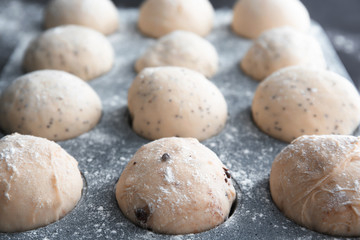 Fototapeta na wymiar Raw dough in muffin tin, closeup