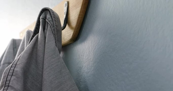 Jumper and shirt hanging on hook 