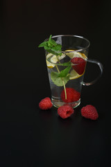 still life of fresh fruits and herbs on a dark background close up