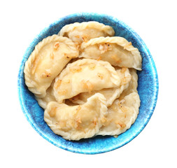 Bowl with tasty dumplings on white background