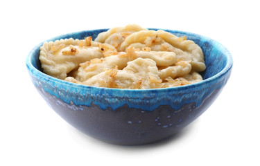 Bowl with tasty dumplings on white background
