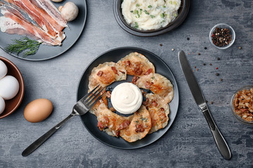 Plate with tasty dumplings served on table