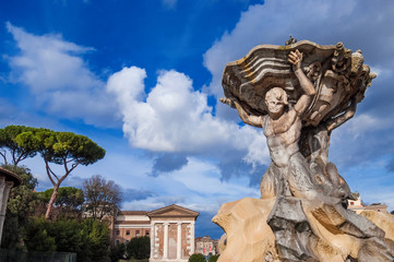 Fountain of the Tritons, completed in 1715, and the ancient Temple of Portunus, in the center of Forum Boarium square, in Rome
