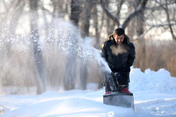 Snow removal with a snow blower 