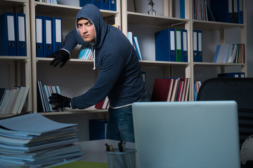 Young man in industrial espionage concept