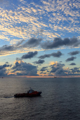 Offshore oil and gas crew boat approach to the platform for transfer passenger between crew boat and platform.