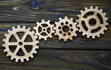 gears on a wooden background. The concept of business, creative, logical thinking. Teamwork....