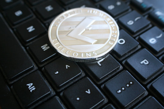 Litecoin On Computer Keyboard Close Up High Quality Stock Photo 