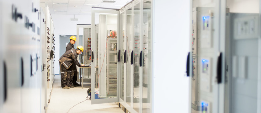 Field service crew testing electronics or inspecting electrical installation system