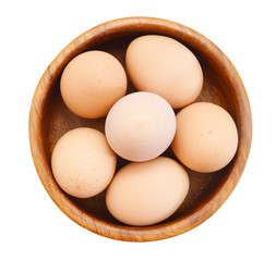 Eggs in wooden bowl on white background