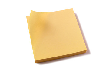 Yellow sticky square post it note pad isolated on white background photo