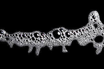 White washing foam shape isolated on black.