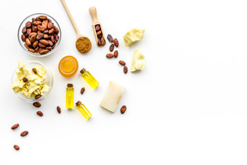 Cocoa butter for skin care. White background top view copy space