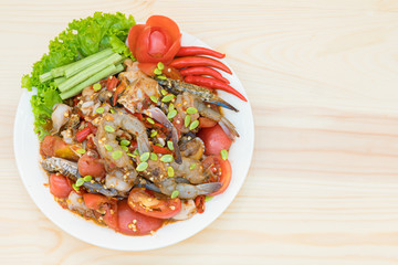 papaya salad with fresh shrimp on wooden table - top view food with copy space and text here.
delicious popular menu of  thai food.