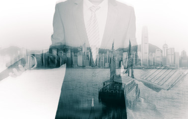 Double exposure of businessman and Hong Kong city view