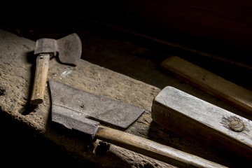 Two axes on a wooden workbench
