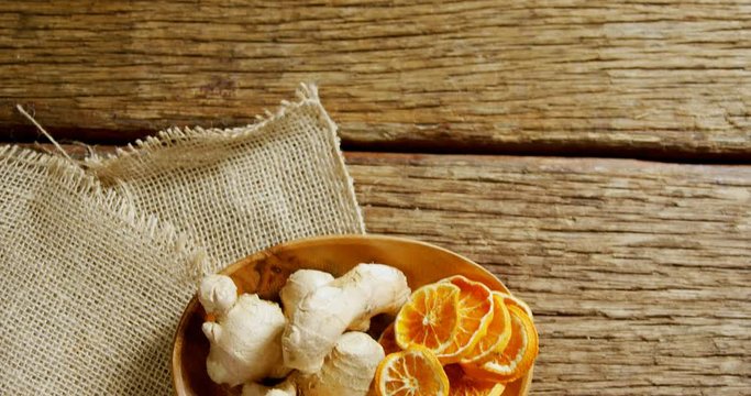 Dried orange with ginger in a plate 