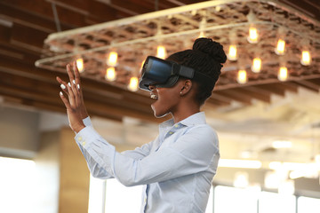 Girl in VR glasses touching air