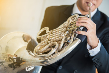 French horn music instrument orchestra classic hornist and player. - obrazy, fototapety, plakaty